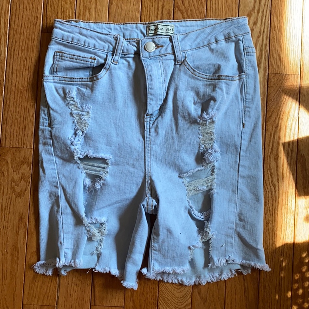 Light blue ripped cutoff bermuda shorts